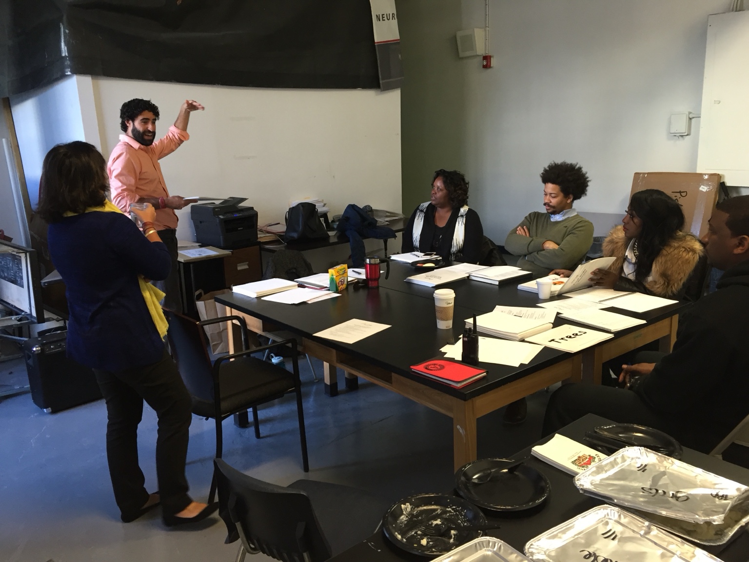 Adam Aronovitz facilitating a group of adults in a workshop.