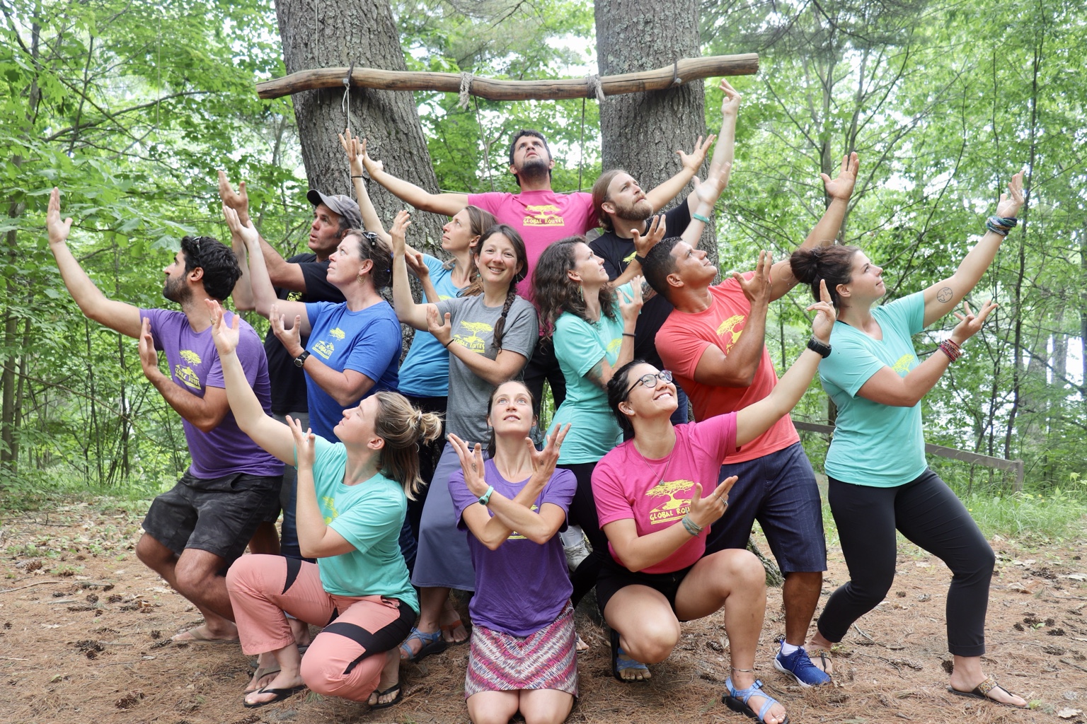 Adam Aronovitz with a Global Routes team during a playful team gathering outdoors.