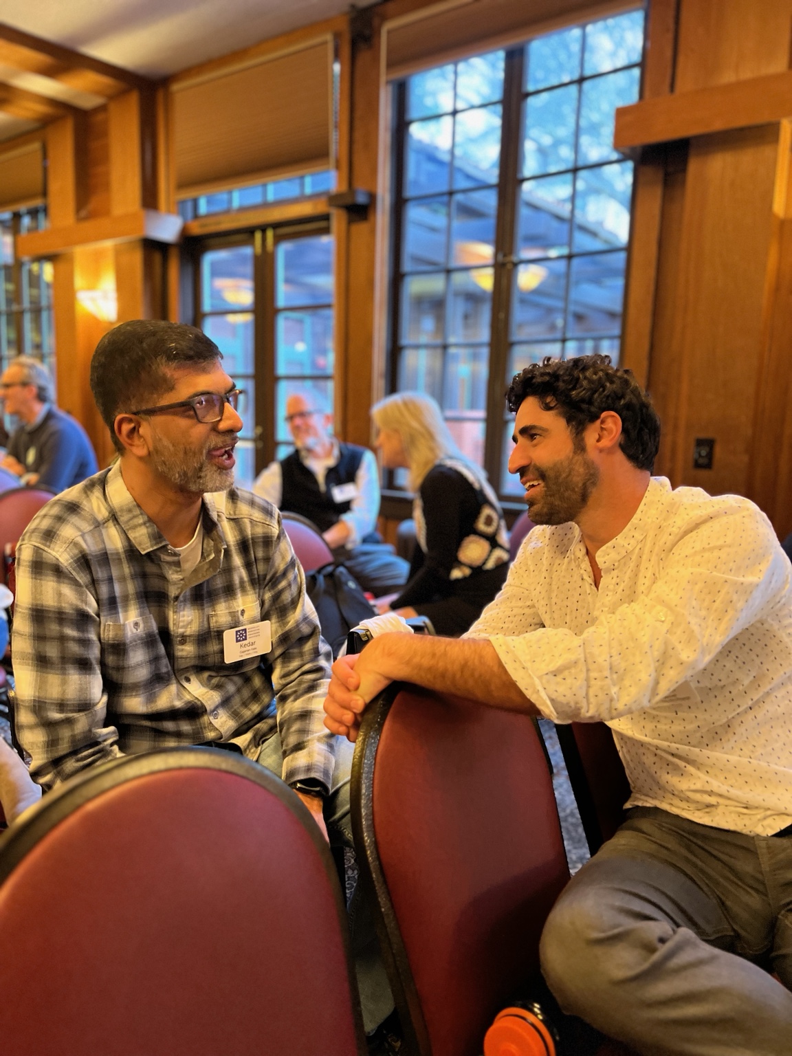 Adam Aronovitz in conversation during a professional gathering.